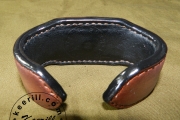 Thick leather bracelet on a steel plate